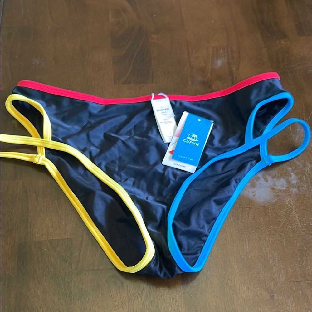 NWT Cupshe Women's Black Bikini Bottom w/Red, Yellow, & Blue Trim, size large.